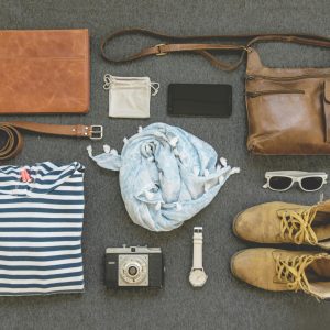pexels-photo-322207-322207 Vintage travel essentials flat lay with leather bags, shoes, camera, and clothing.